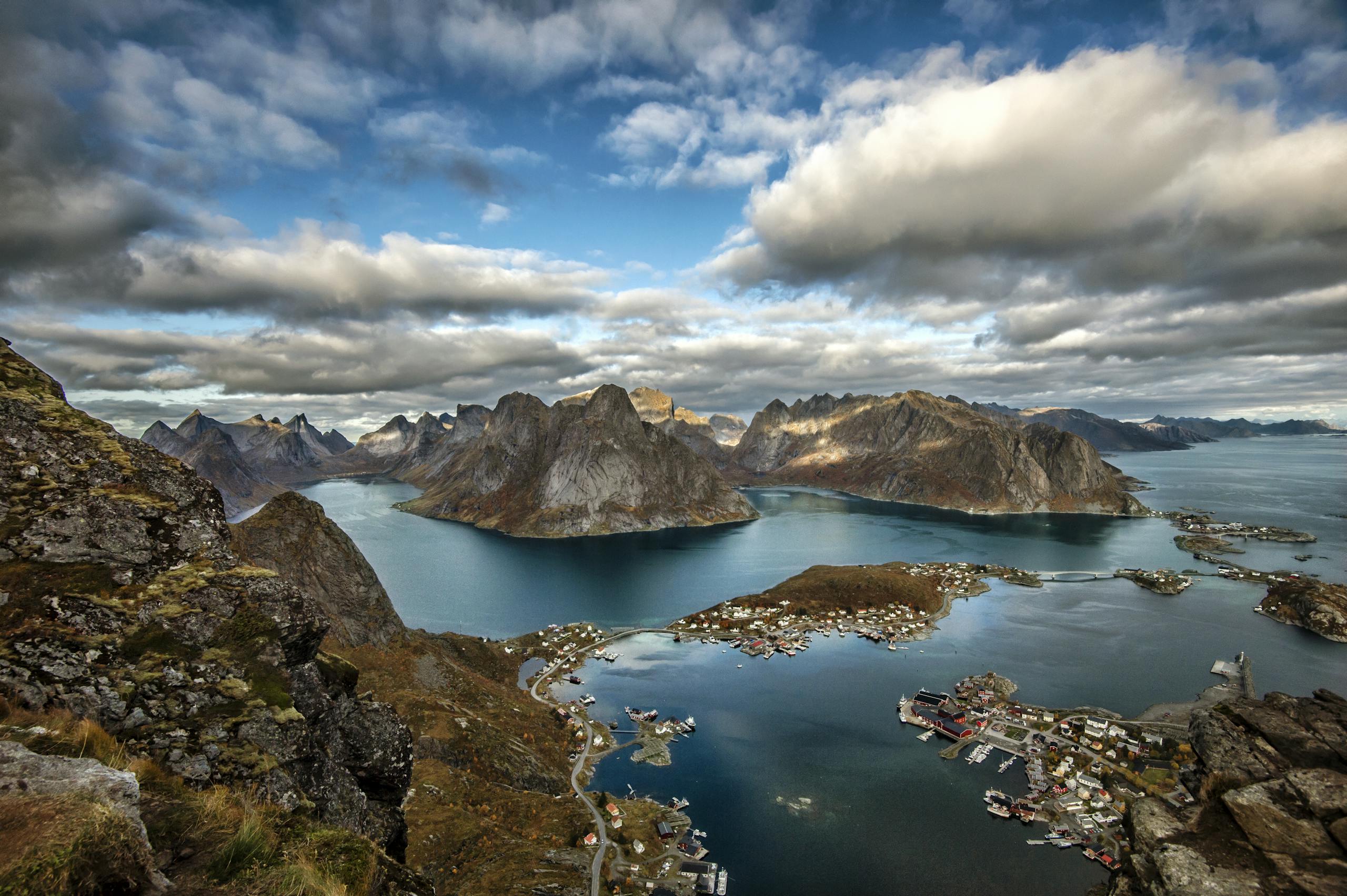 Breathtaking aerial view of the Lofoten Islands with dramatic mountains and sea.