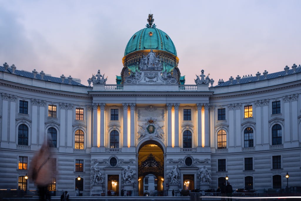 Stunning view of Hofburg Palace in Vienna at twilight showcasing its architectural beauty.